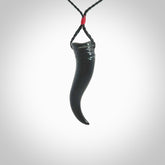 Black jade Italian Horn pendant. Handmade jade jewellery made by NZ Pacific and for sale online. Black Jade Goat Horn pendant worn for protection over evil eye, bad luck and promotes fertility. Ancient symbolic necklace hand made in Australian Black Jade.